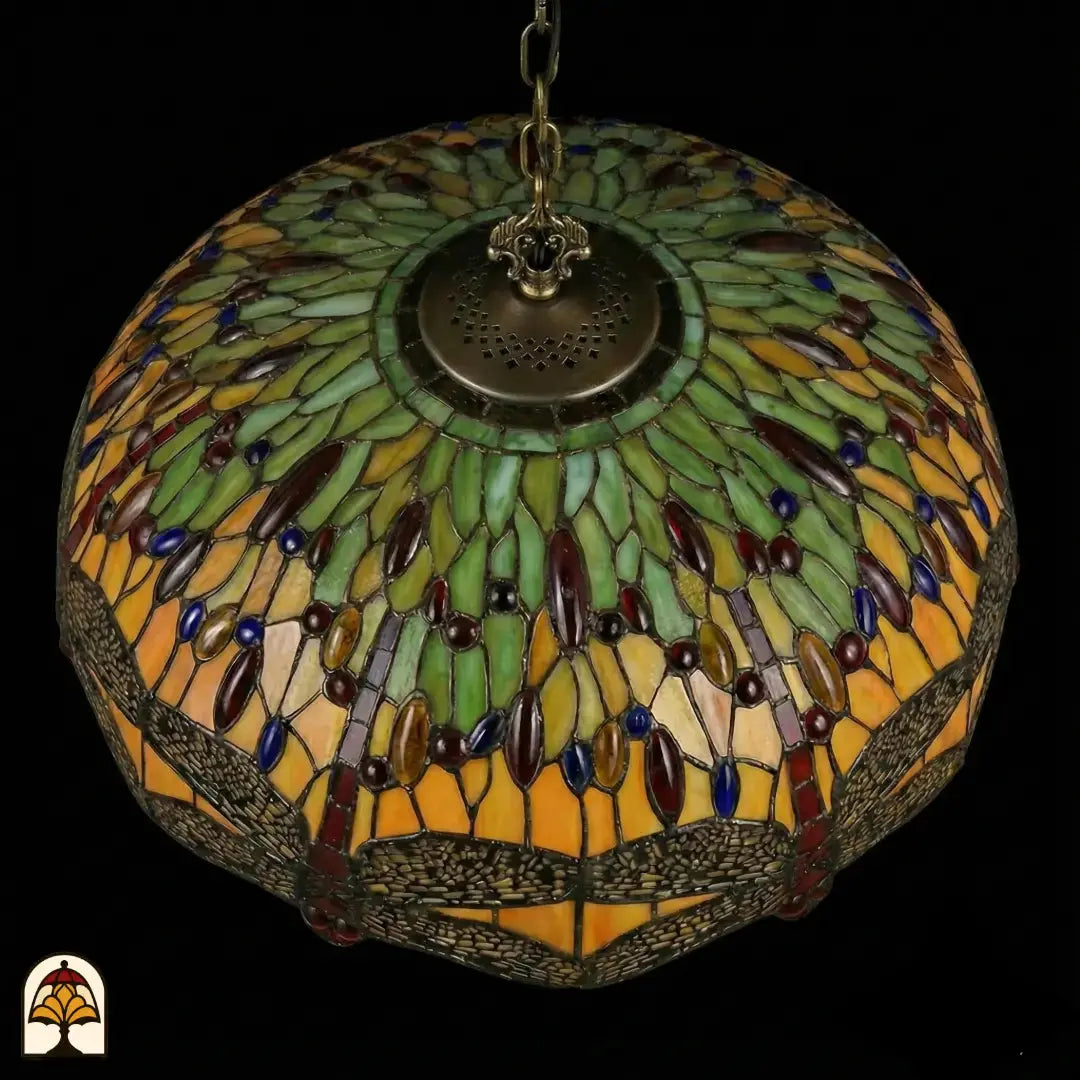 Bovenaanzicht onverlichte kap Libellula Aurelia ⌀50, gele en groene glas-in-lood panelen met rode en blauwe juwelen, libellenfries langs rand, bronzen centrale fitting