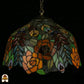 Tiffany lamp hanglamp onverlicht van dichterbij, koepelvormige kap met oranje, bruine en roze rozen, grijsgroen getextureerd glas en gekleurde bladeren en ovale glaskralen